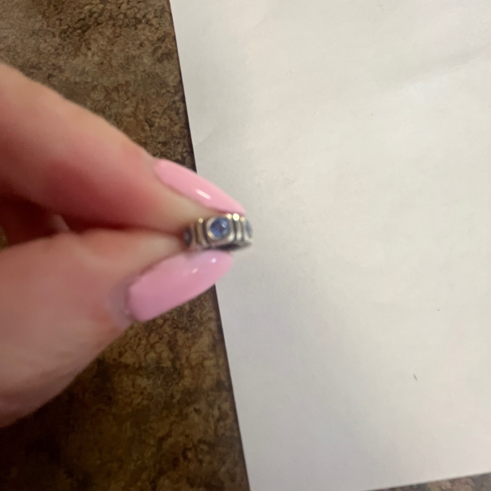 Pandora charm with blue jewels on the side
